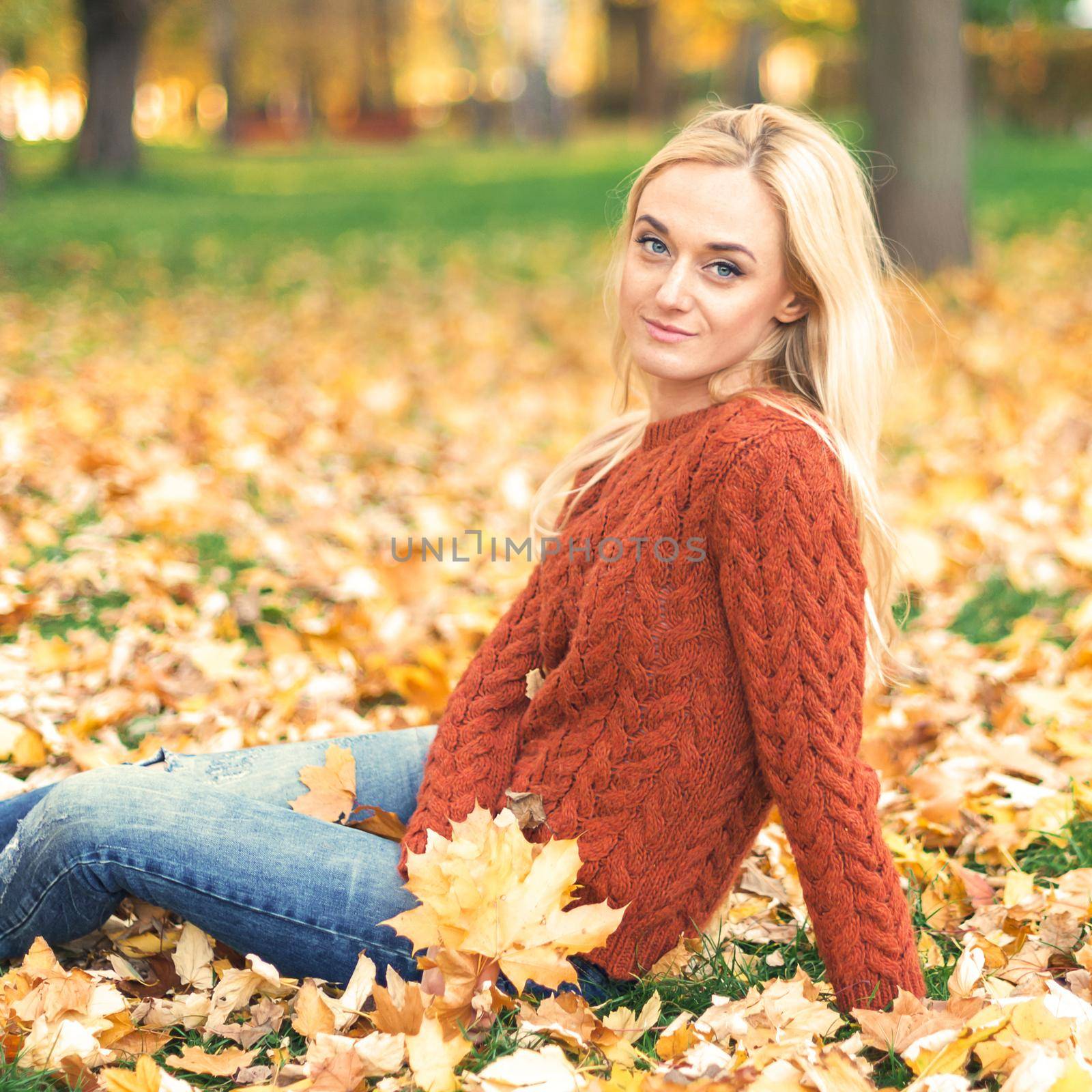 Young woman in park on autumn day by okskukuruza