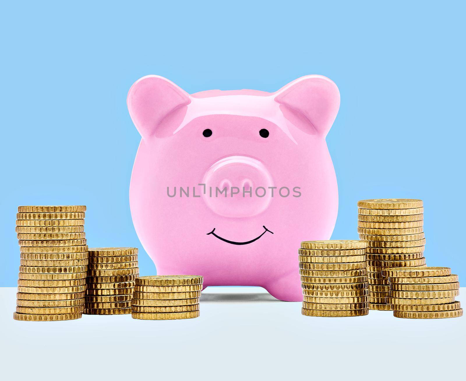 Close up of a pink piggy bank on white background