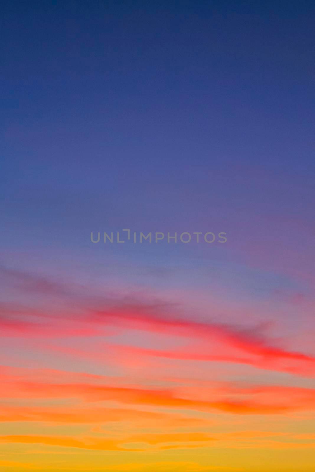 Amazing colorful pink violet orange red yellow blue and purple sunset sky panorama in Leherheide Bremerhaven Germany.