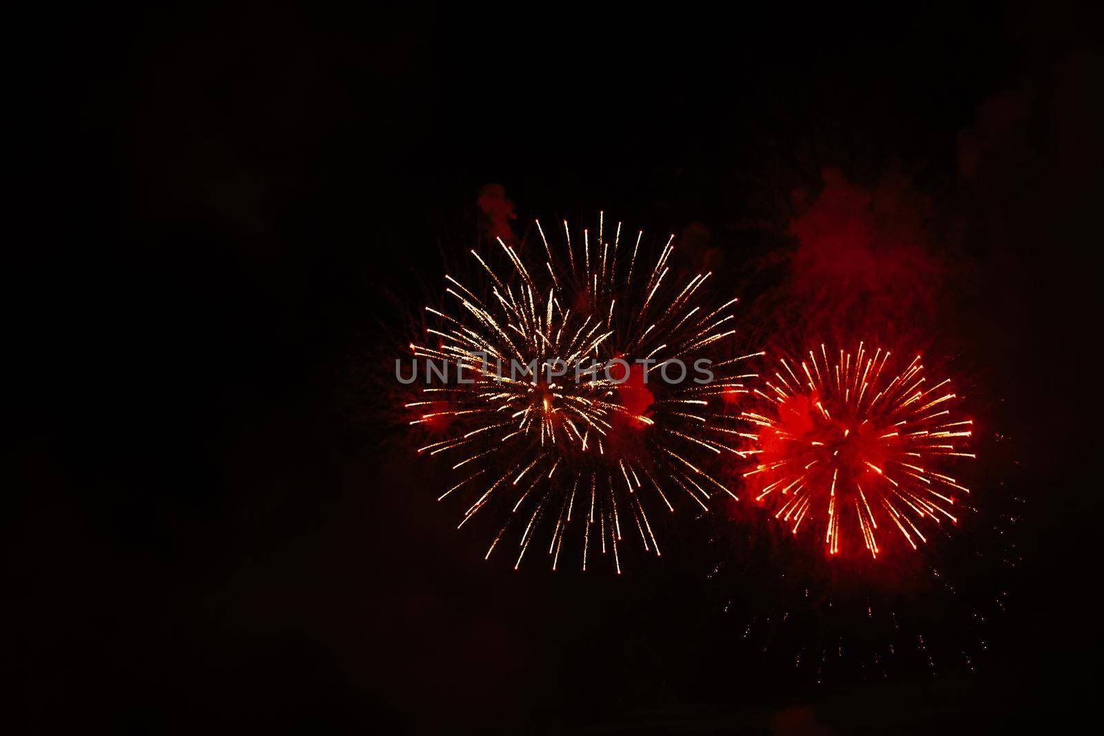 Beautiful salute on a black isolated background. Place for your text. Celebrating New Year or Independence Day.