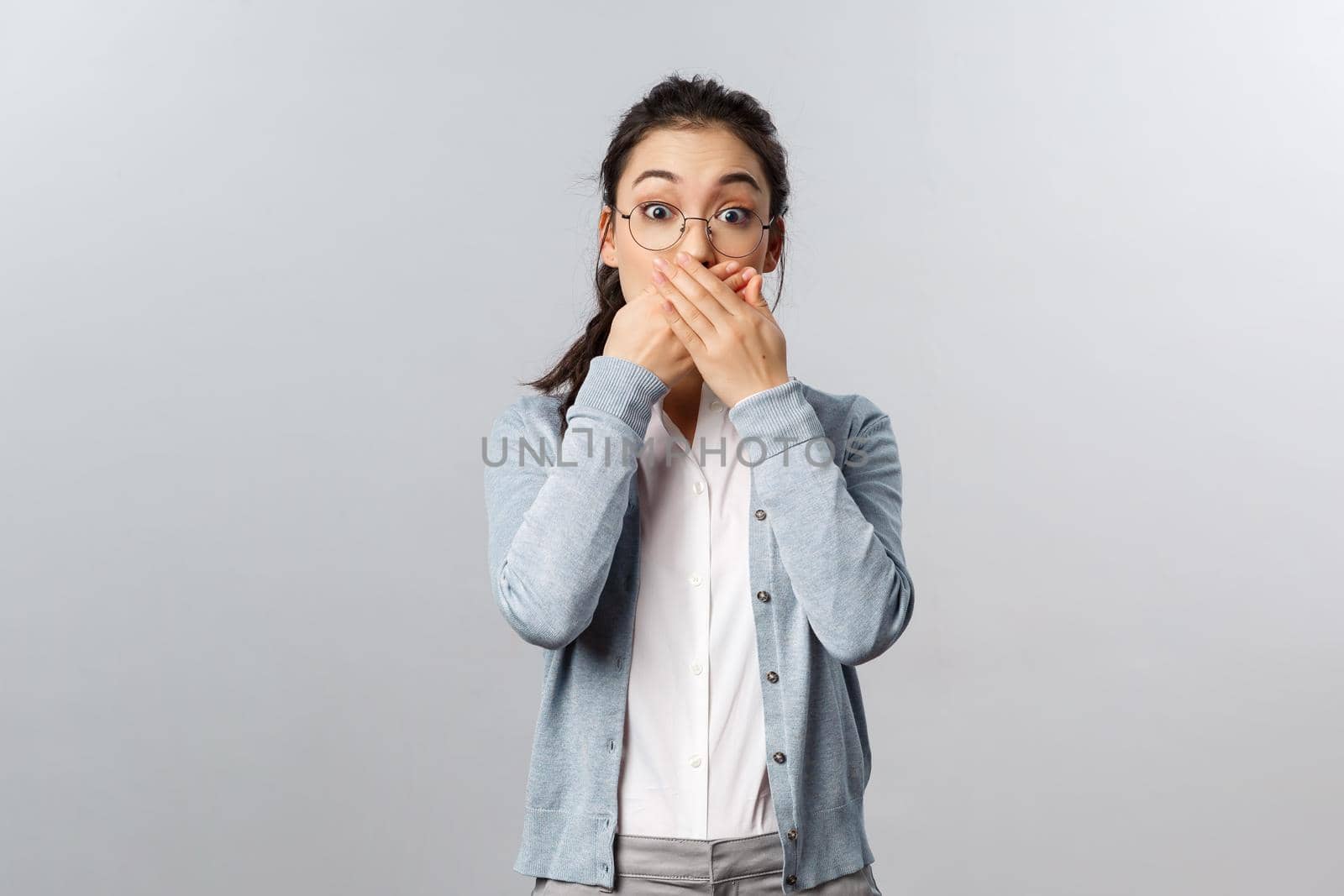 People, emotions and lifestyle concept. Oh my gosh. Portrait of speechless, startled cute asian girl gasping in awe, found out somoeone secret, react shocked, stare camera impressed.