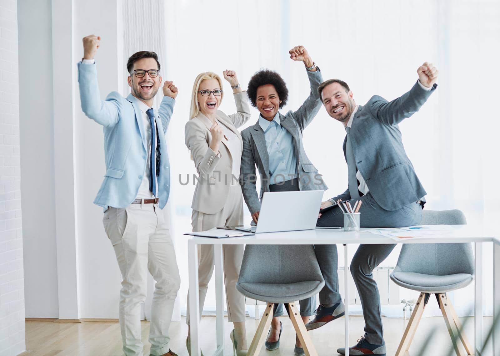 young business people meeting office teamwork celebrating success corporate portrait posing colleague by Picsfive