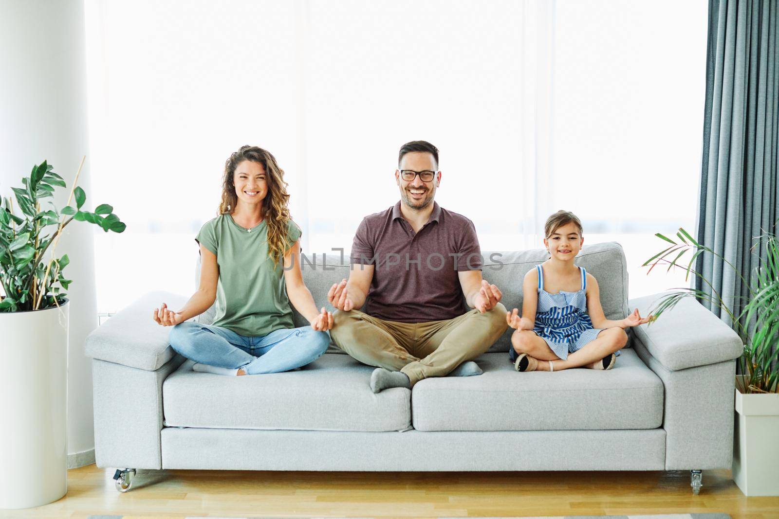 child yoga famil mother home woman exercise girl father fitness together daughter by Picsfive