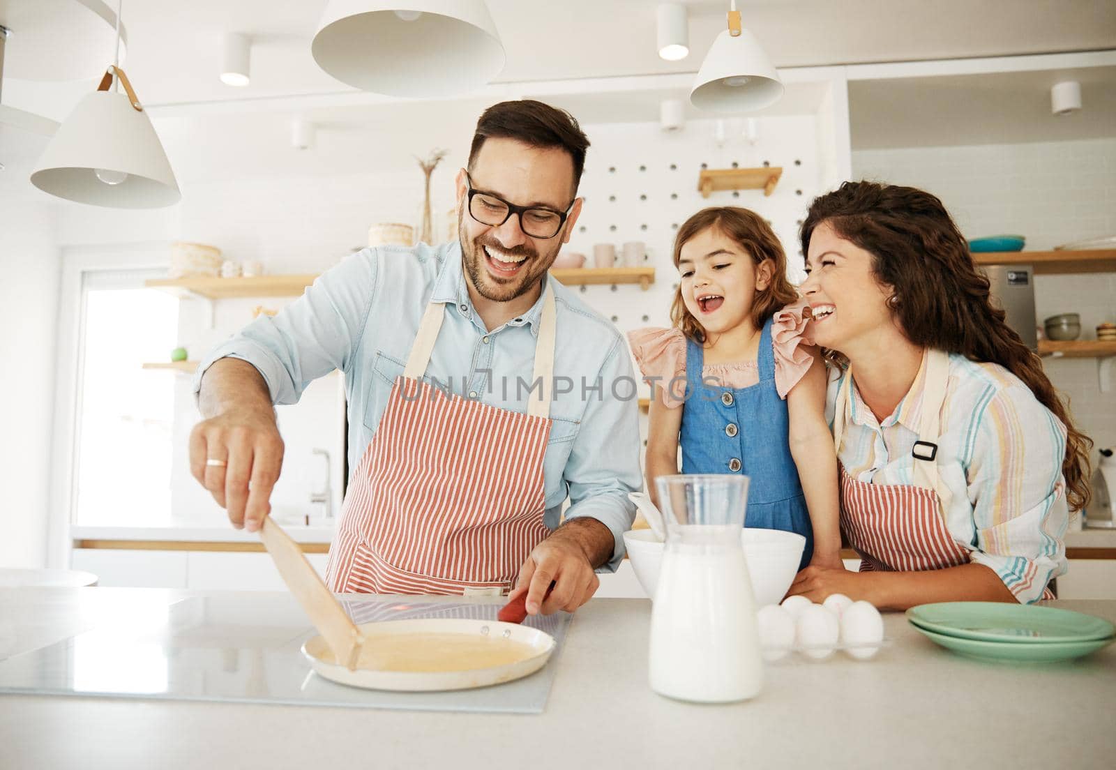 family child kitchen food daughter mother father cooking preparing pancake breakfast happy together by Picsfive