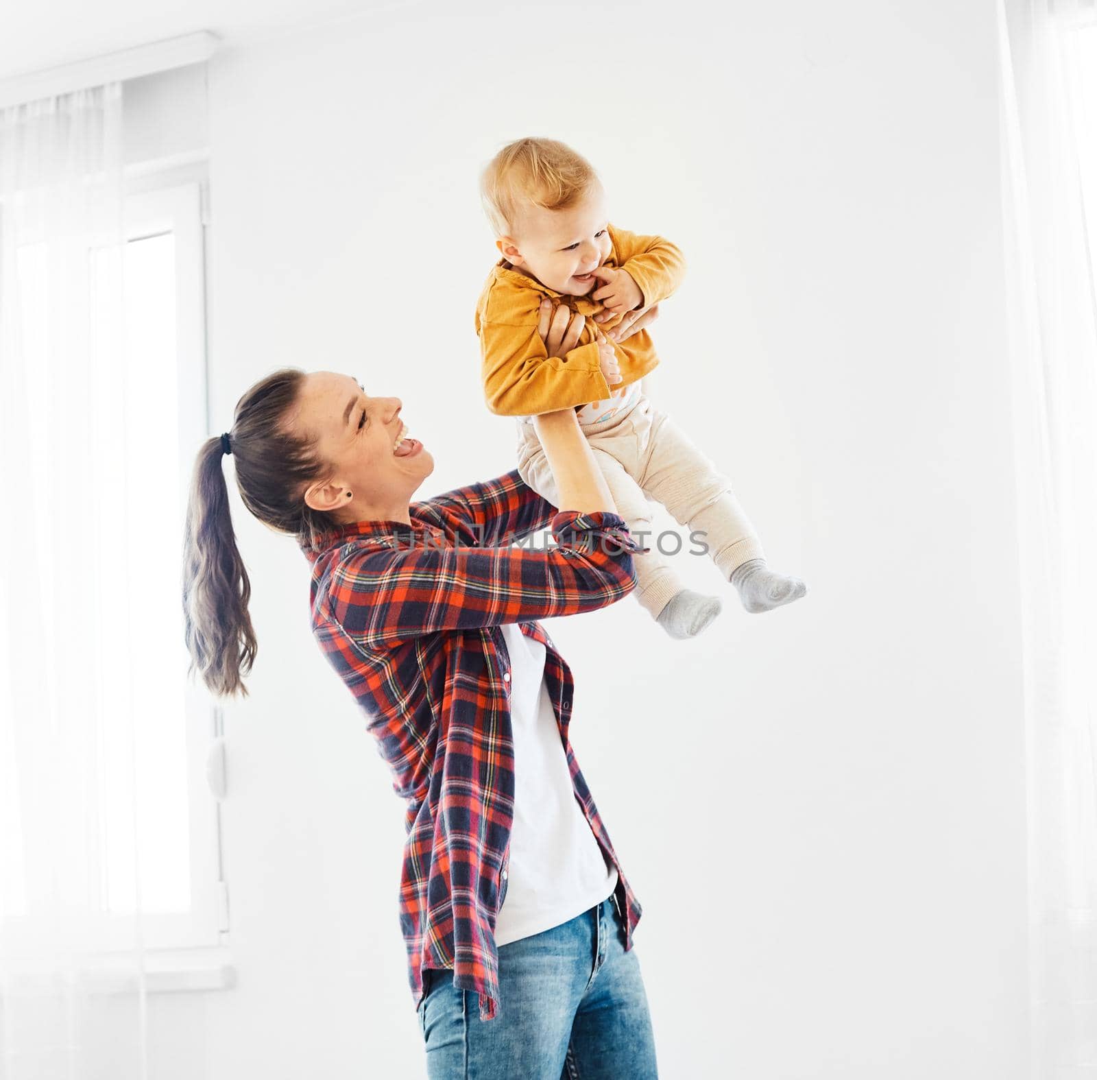 Portrait of a mother and son having fun together at home