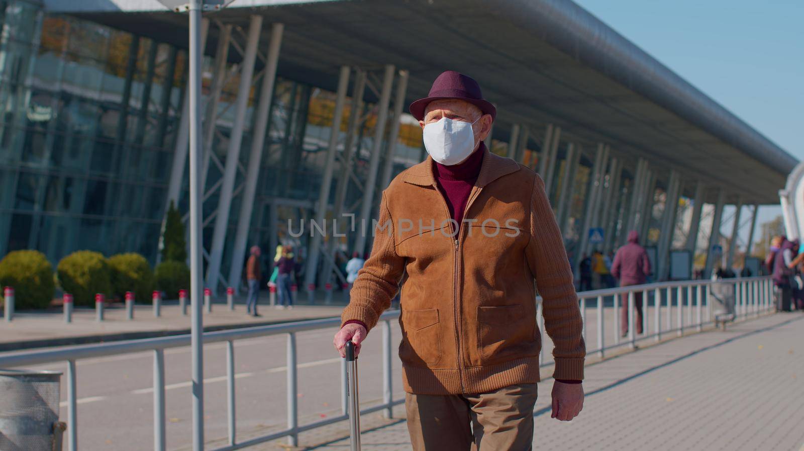 Senior pensioner tourist male grandfather businessman wearing Protective Face Mask, avoid disease COVID-19 coronavirus infection near airport pandemic disease virus epidemic air health illness