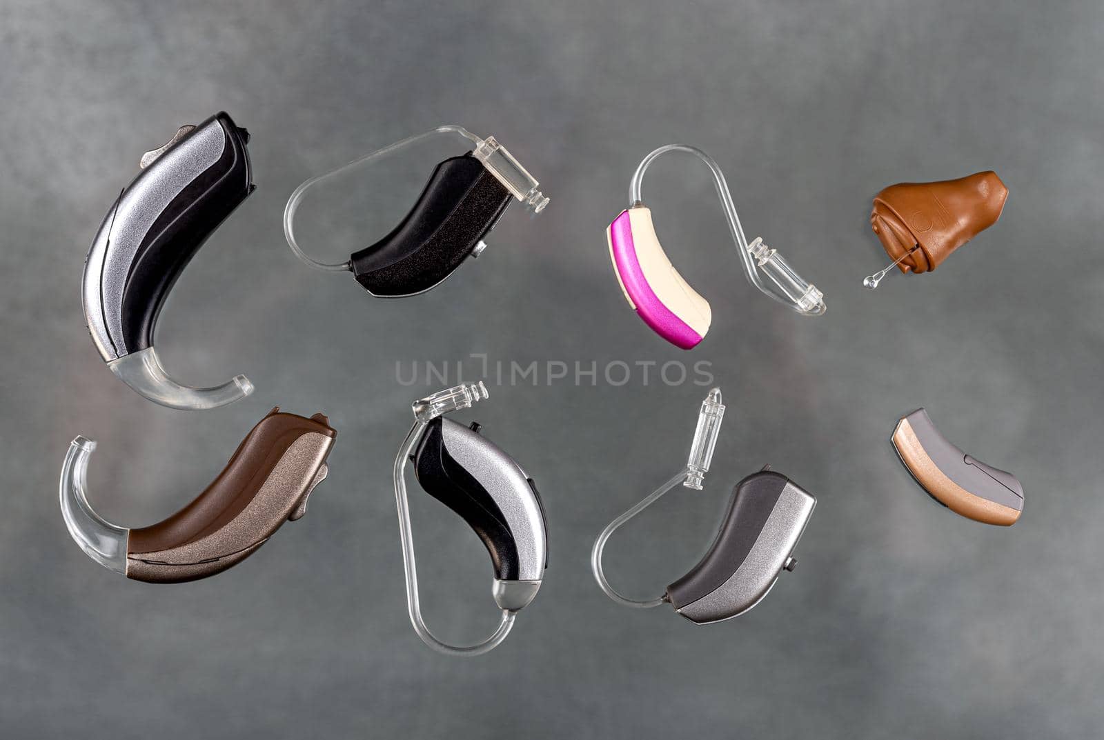 Close-up hearing aid on a light background