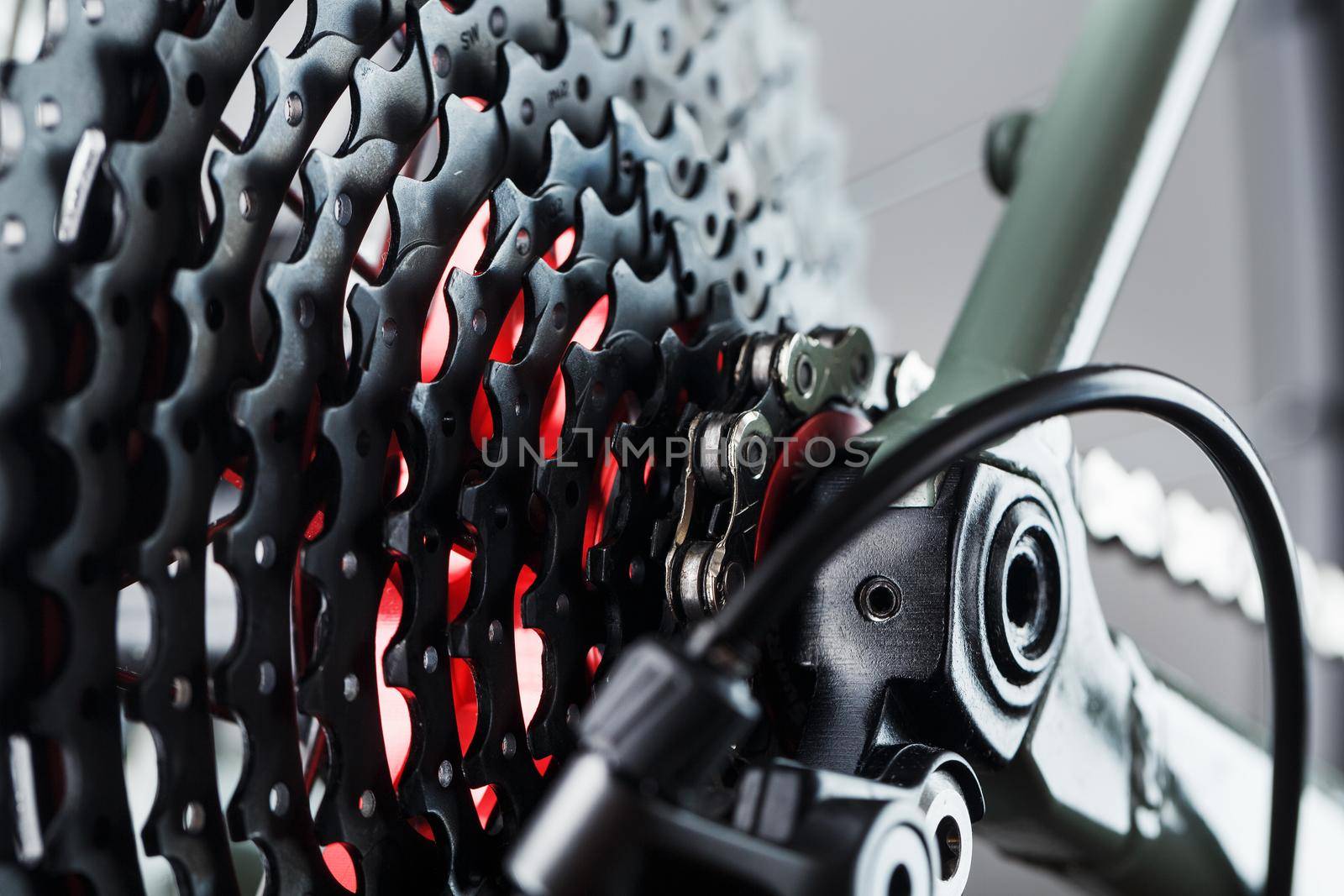 Rear bicycle cassette speeds with a wide range and chain close-up by AlexGrec