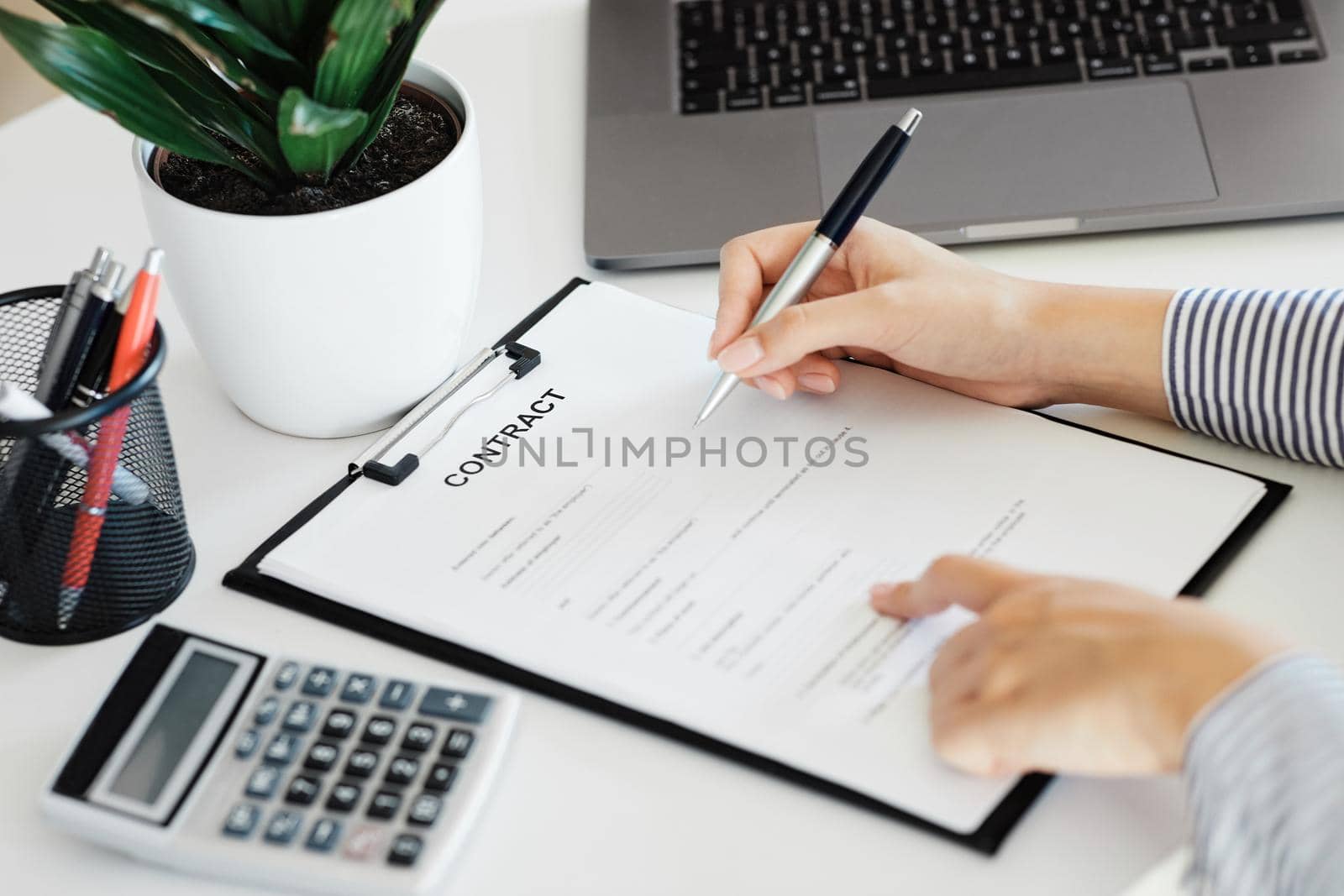 contract business document person pen signing paper agreement office hand signature sign paperwork by Picsfive