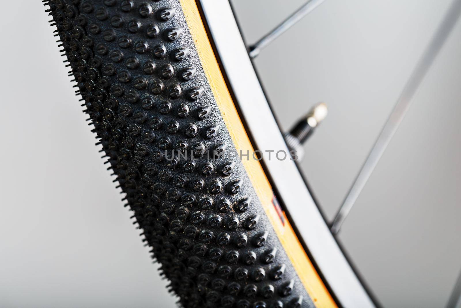 Shallow tread of a bicycle tubeless tire with a brown sidewall by AlexGrec