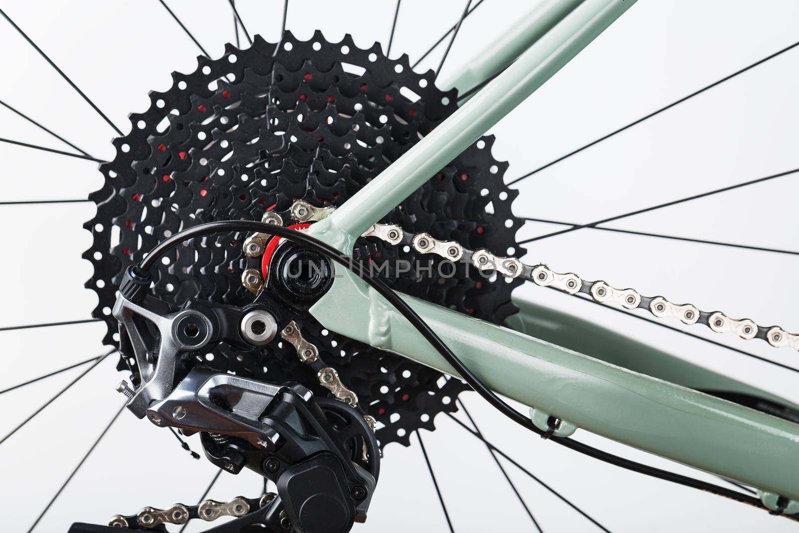 Rear bicycle cassette speeds with a wide range and chain close-up, accessories for repair and tuning of the bike