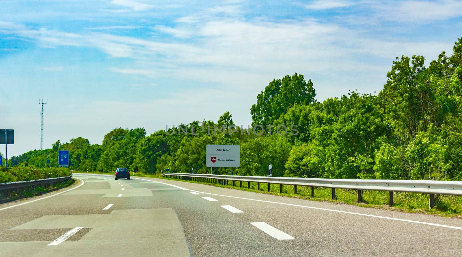 Driving on the German highway from Germany to Netherlands. by Arkadij