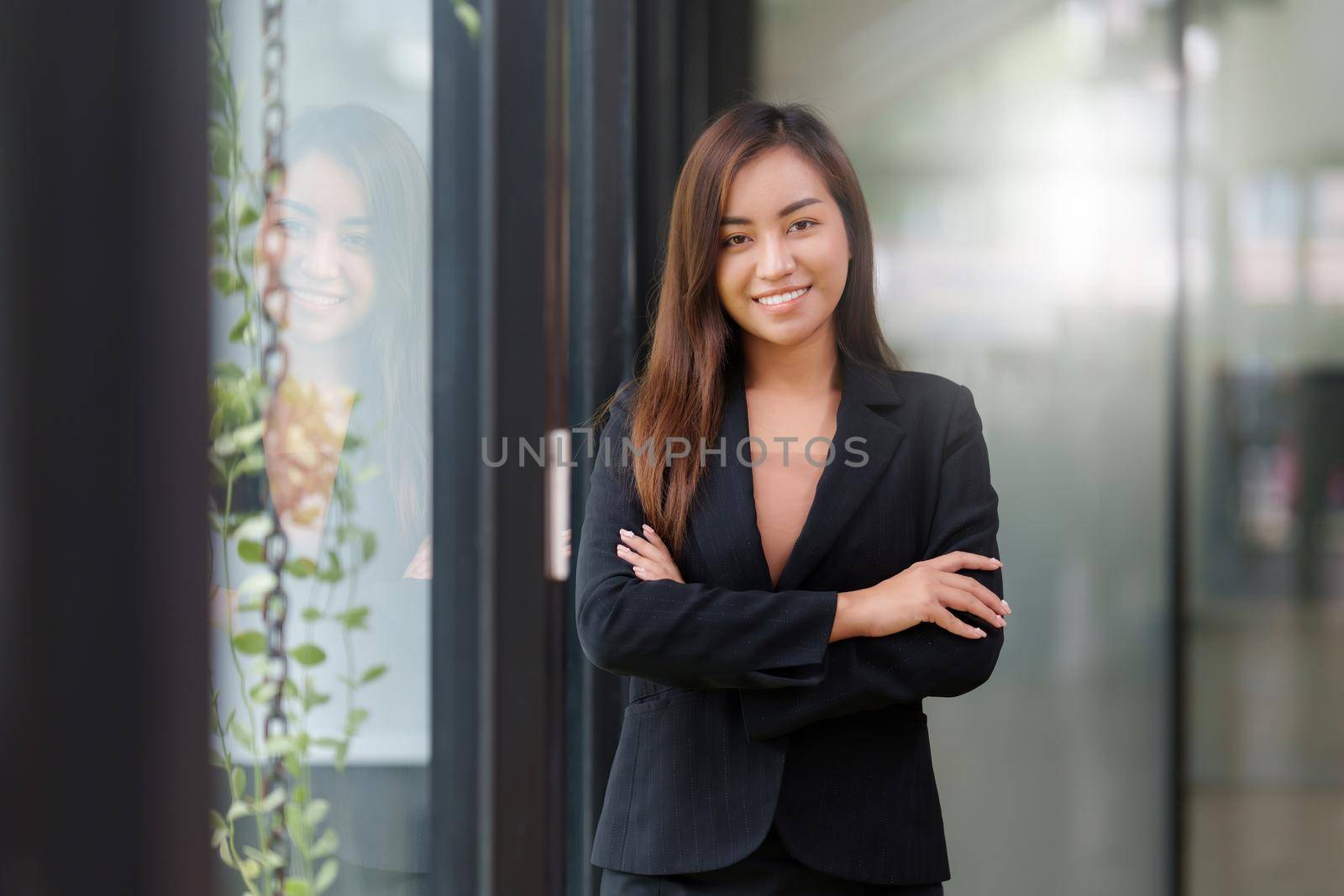 A portrait of Asian happy Businesswoman smiling and working at office