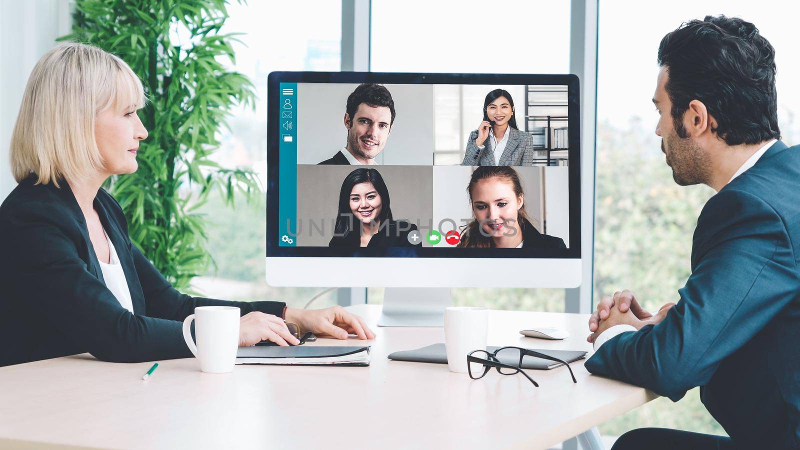 Video call group business people meeting on virtual workplace or remote office. Telework conference call using smart video technology to communicate colleague in professional corporate business.