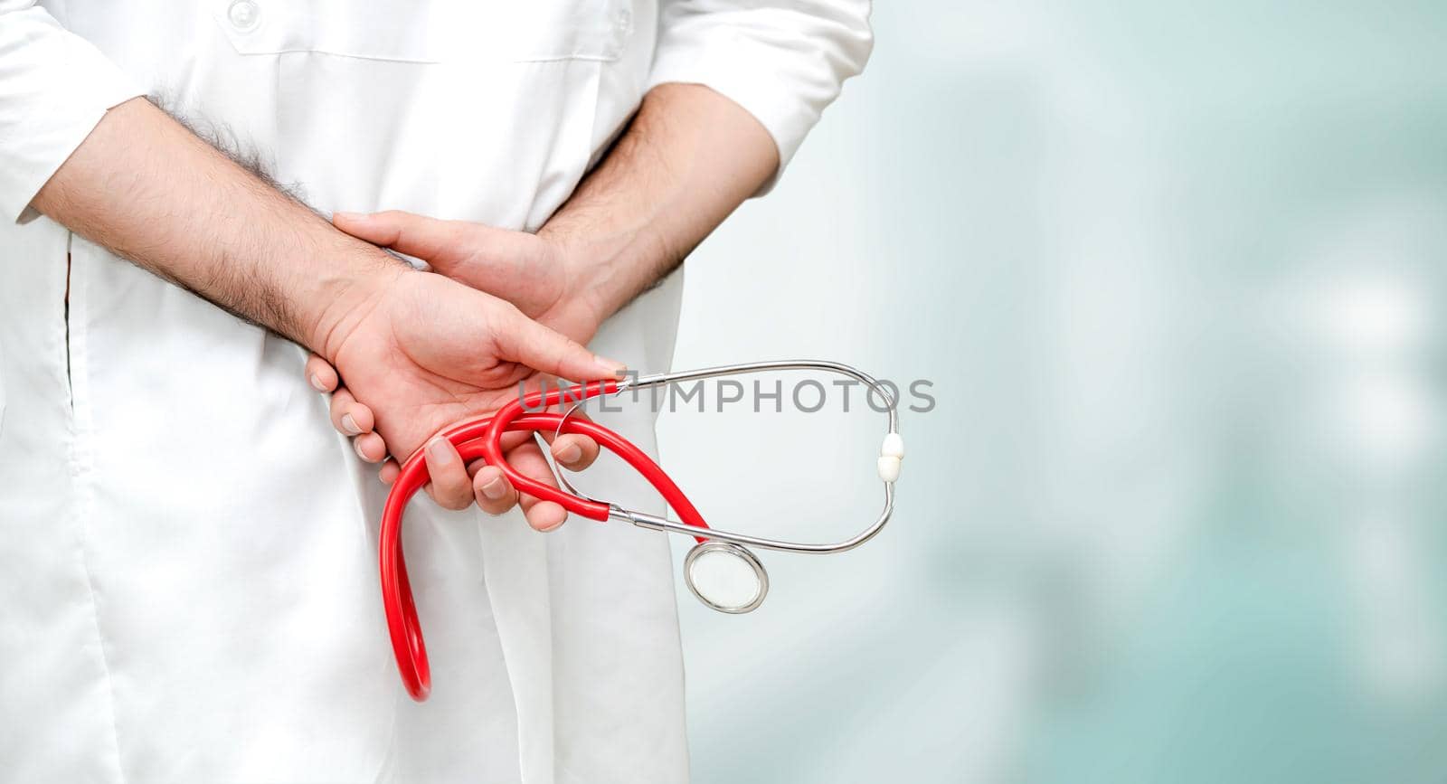 Young male doctor working at the hospital. Medical healthcare and doctor staff service.