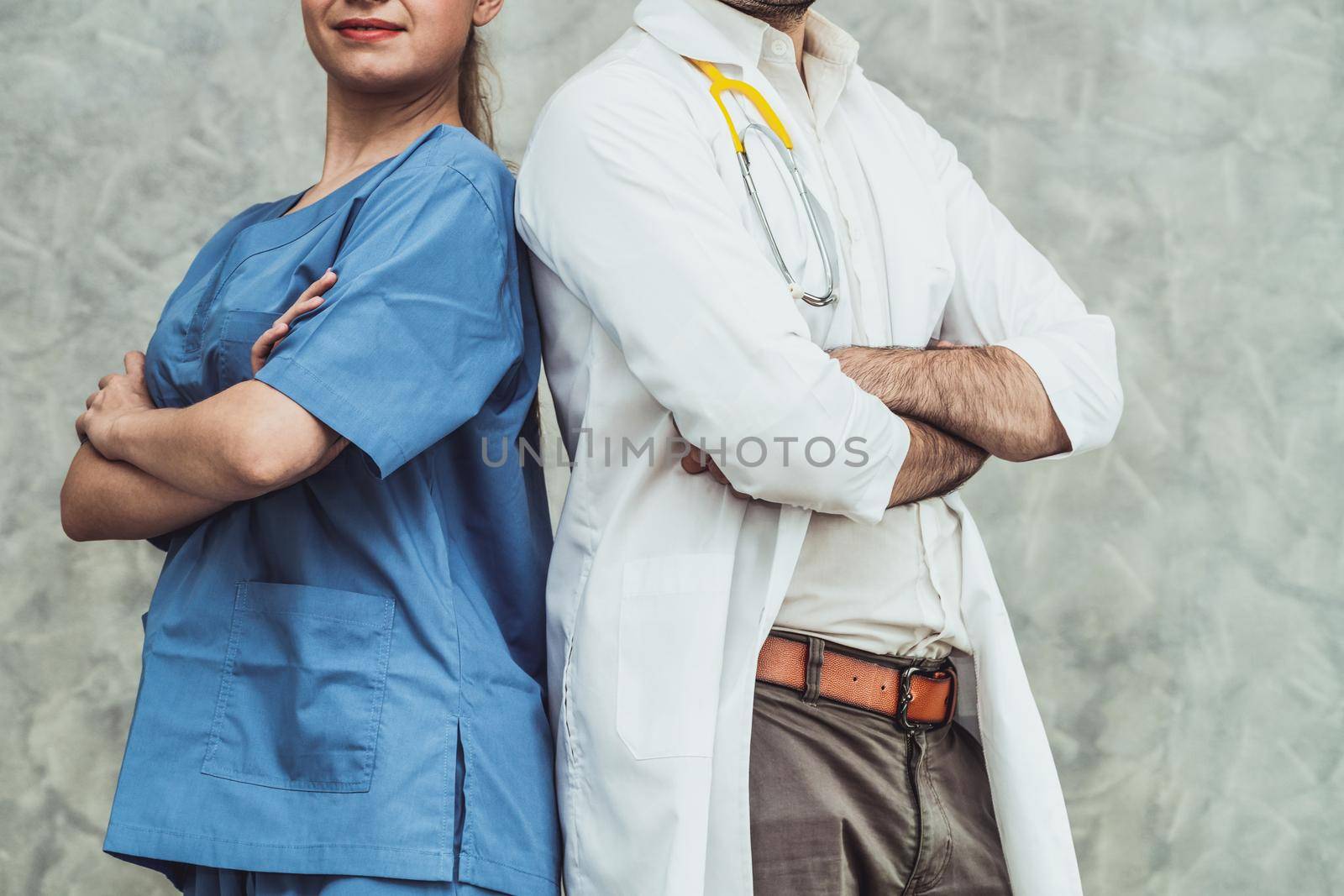 Doctor and nurse working in hospital. Healthcare and medical staff service concept.