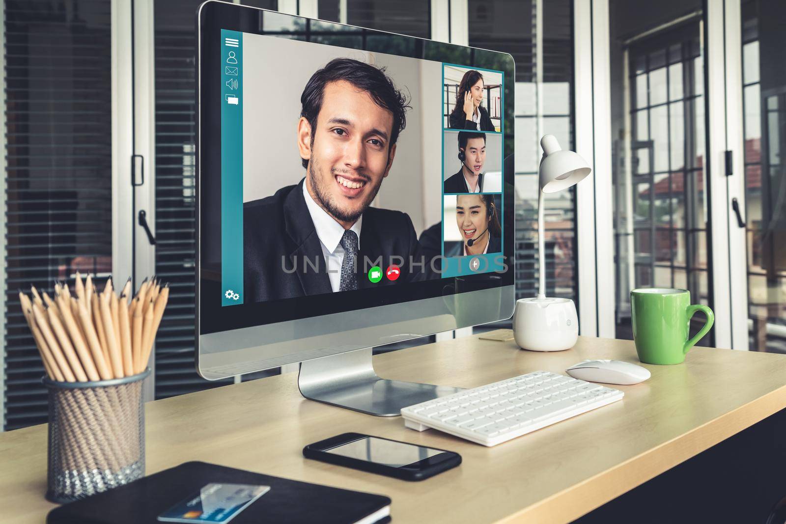 Video call business people meeting on virtual workplace or remote office. Telework conference call using smart video technology to communicate colleague in professional corporate business.