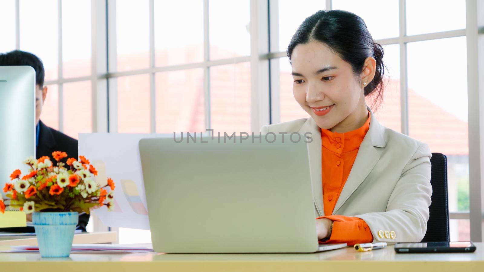Business people working at table in modern office room while analyzing financial data report .