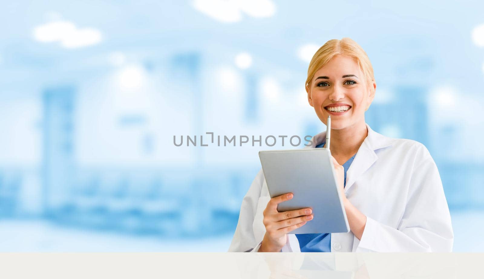 Doctor using tablet computer at the hospital. Medical healthcare and doctor staff service.