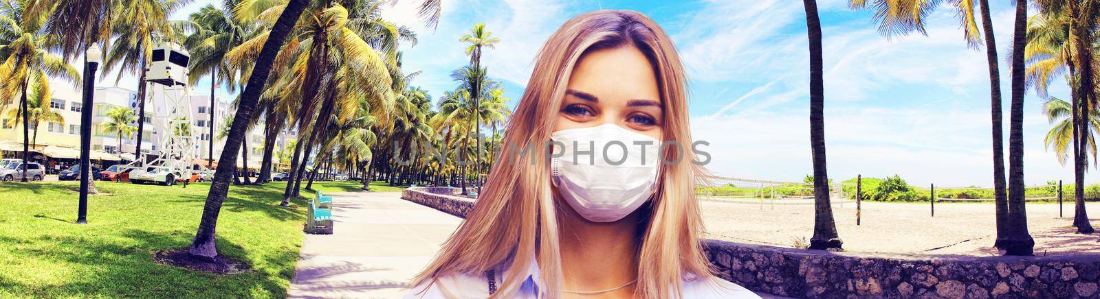 Beautiful tourist woman with corona virus mask at the beach by Taut