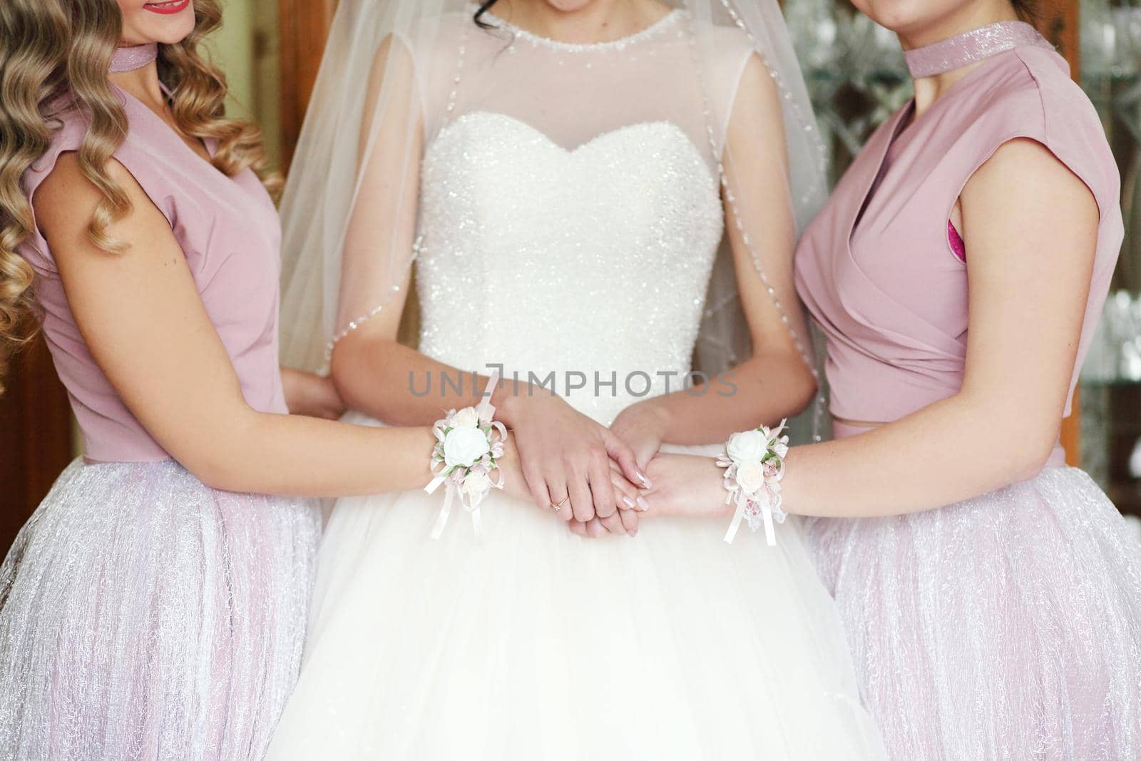 Bride and girlfriends hug in the room. Morning Bride and girlfriends.