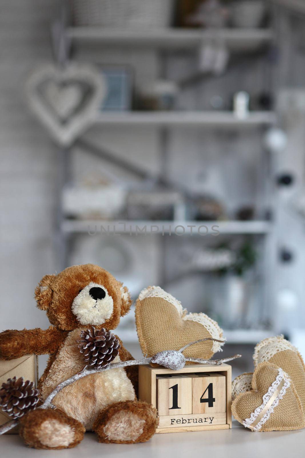 Teddy Bear with heart sitting on wood table, Valentine's day and love concept