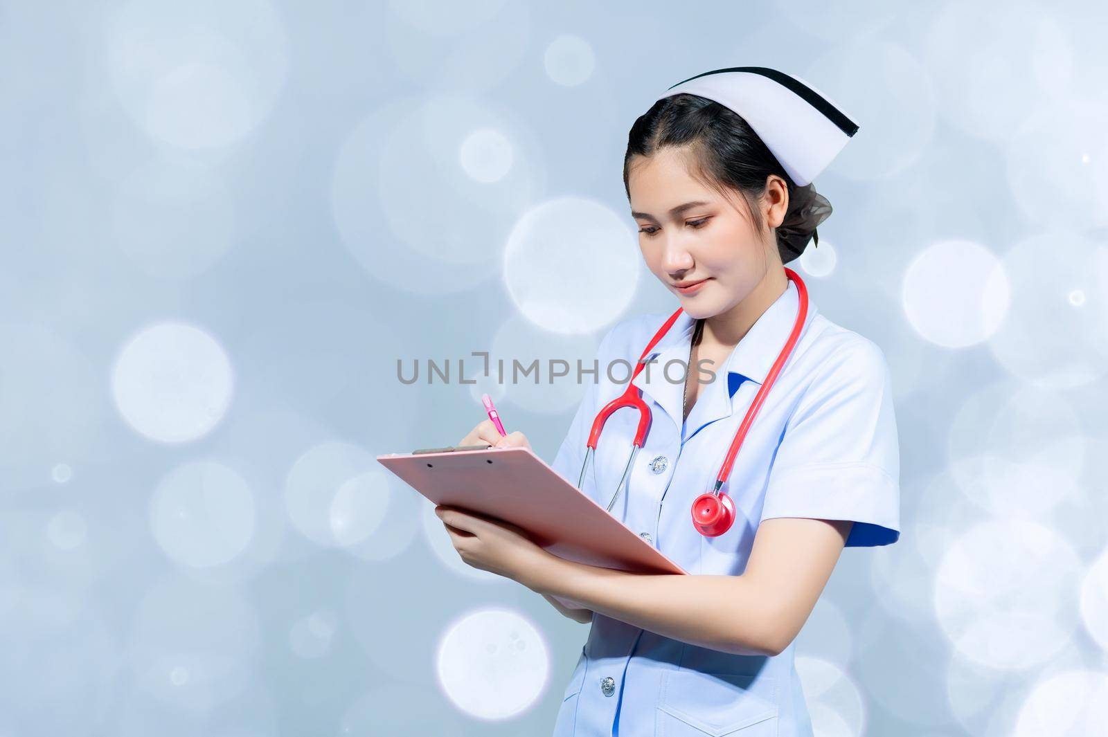 Female doctors are recording on the patient's history report by sarayut_thaneerat