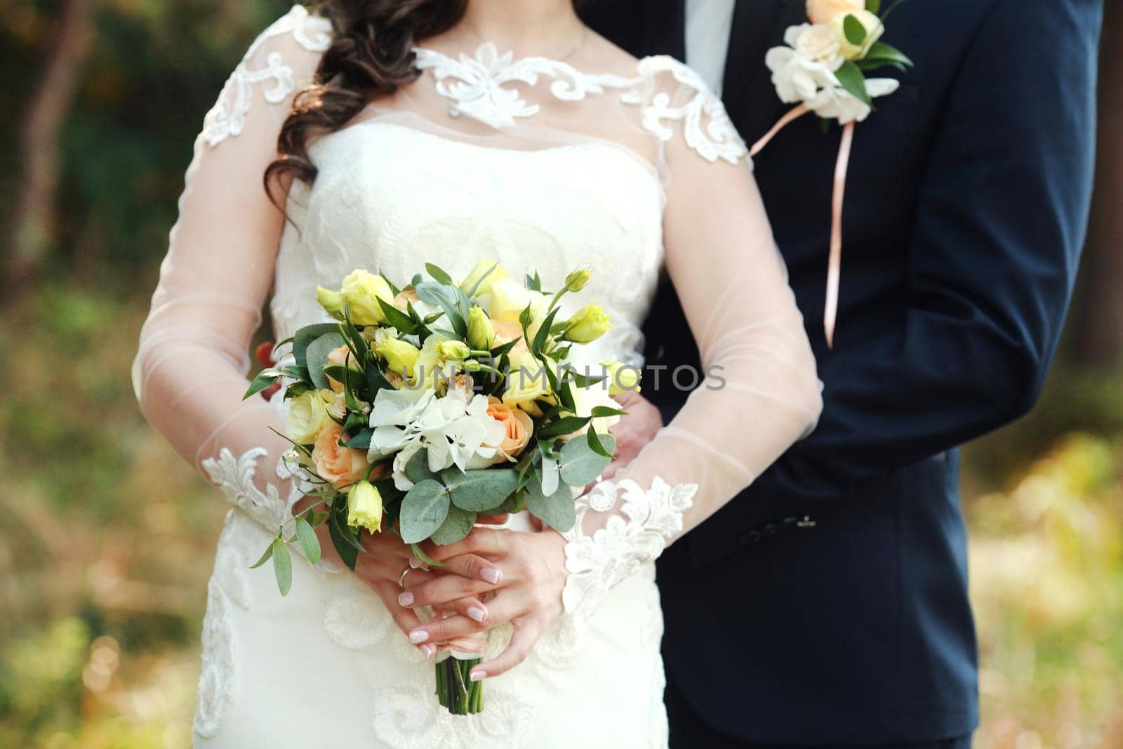 wedding bouquet in bride's hands by IvanGalashchuk