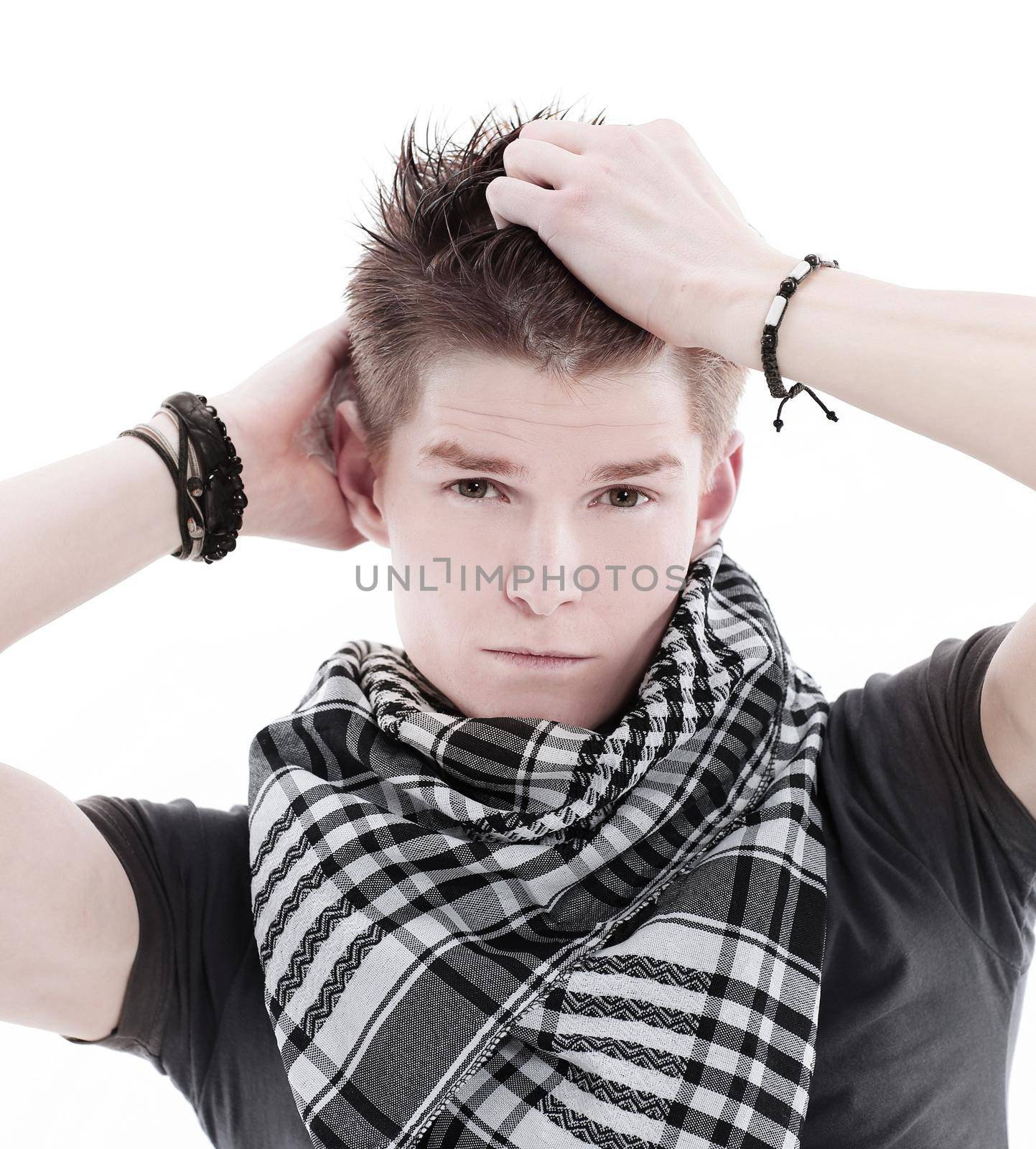 young man in a t-shirt and scarf.isolated on a white background.