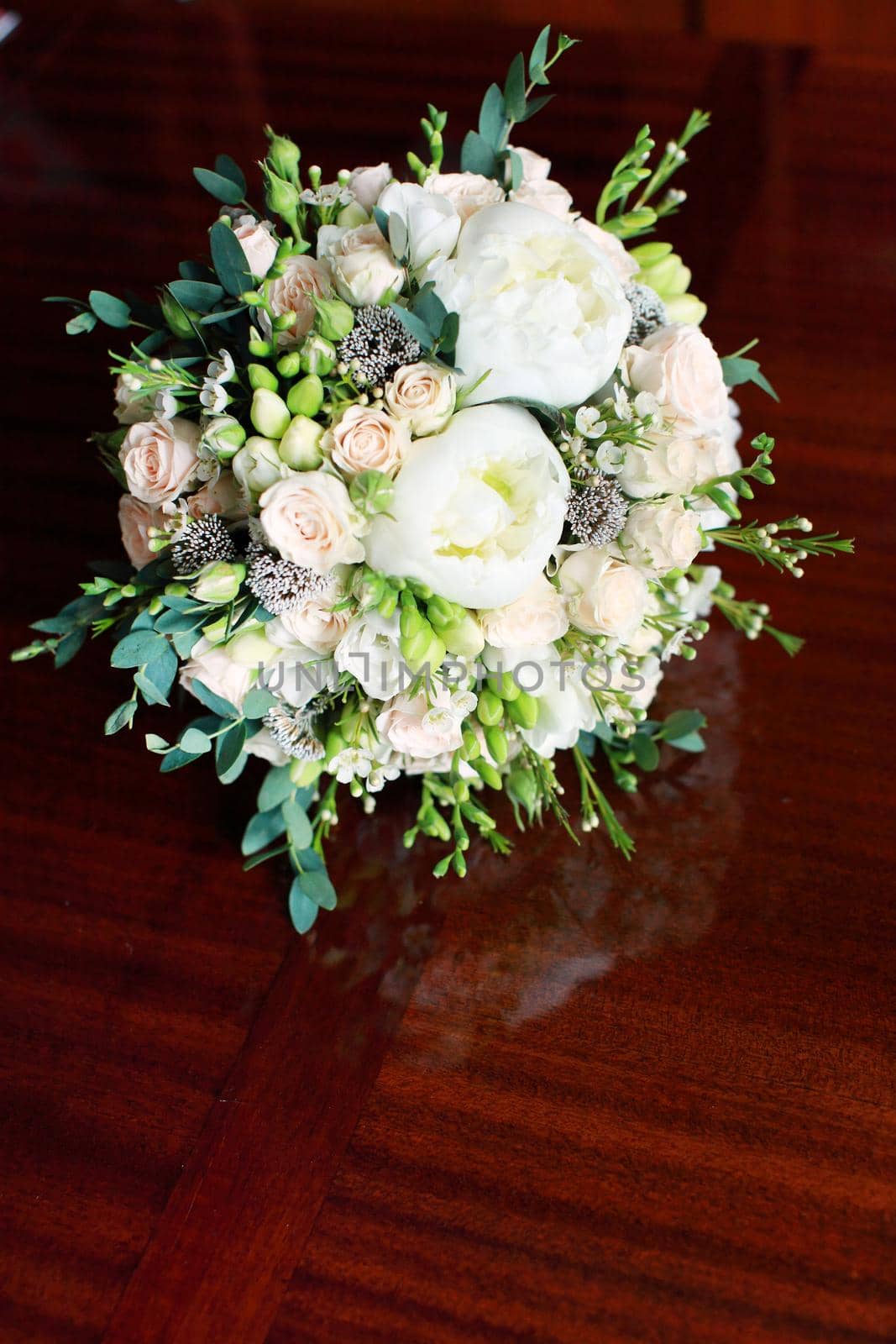 close up of wedding bouquet on the table by IvanGalashchuk