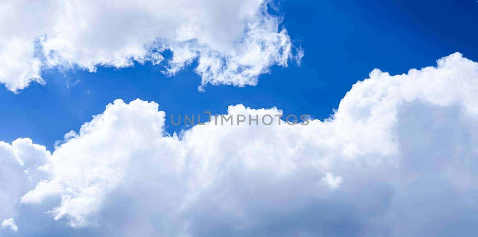 Cloudy sunny sky as abstract background, bright colours, beauty in nature by Anneleven