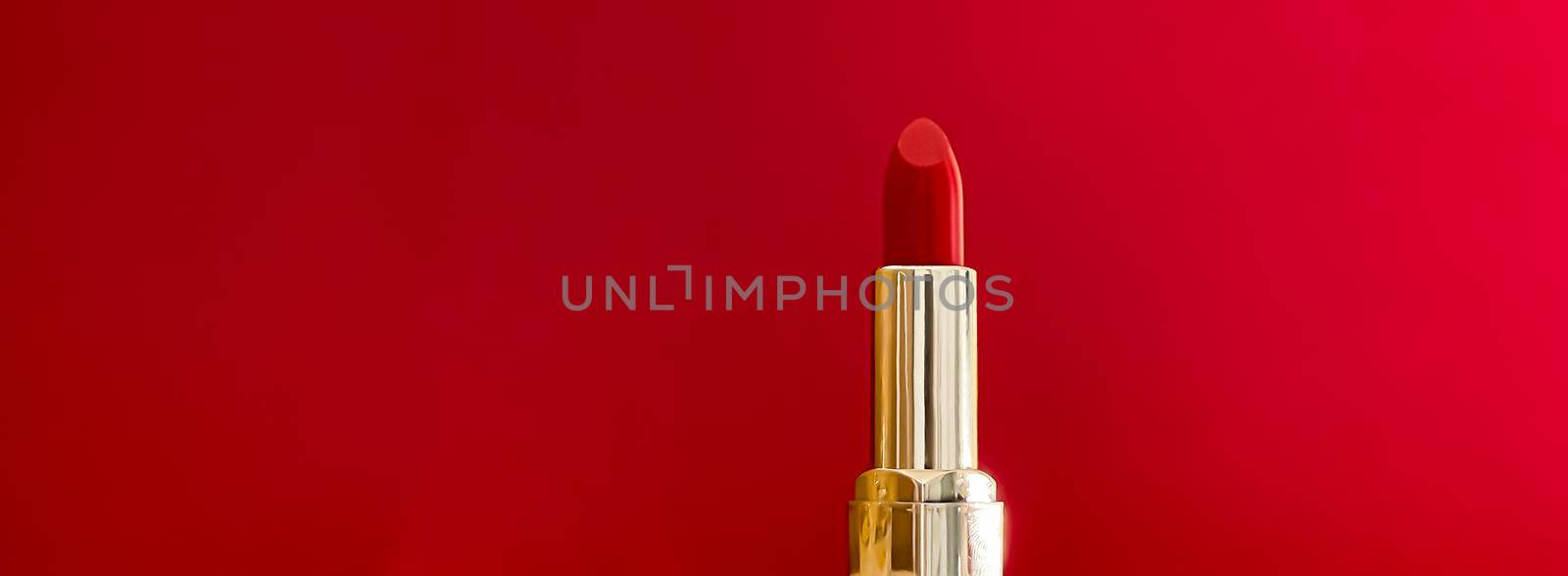 Red lipstick in golden tube on colour background, luxury make-up and cosmetics for beauty brand product design by Anneleven