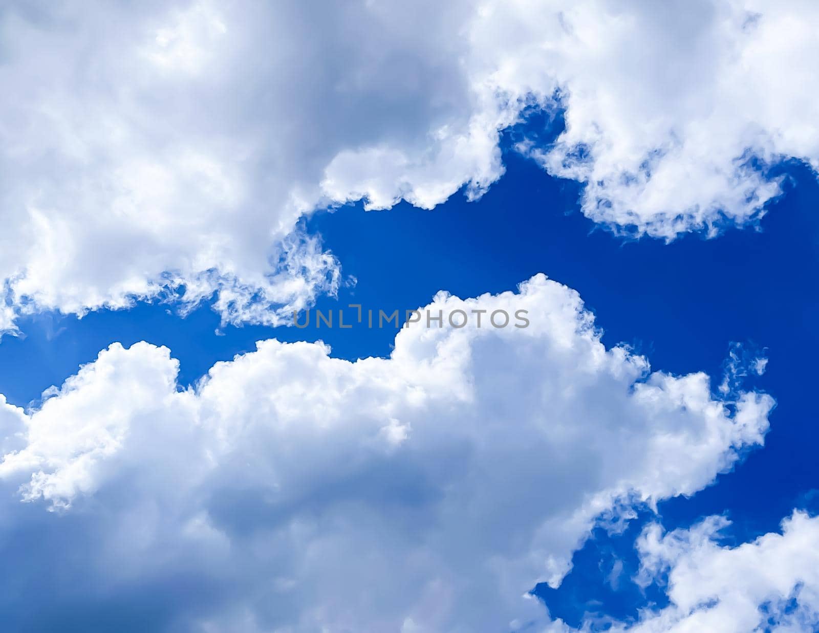 Cloudy sunny sky as abstract background, bright colours, beauty in nature concept