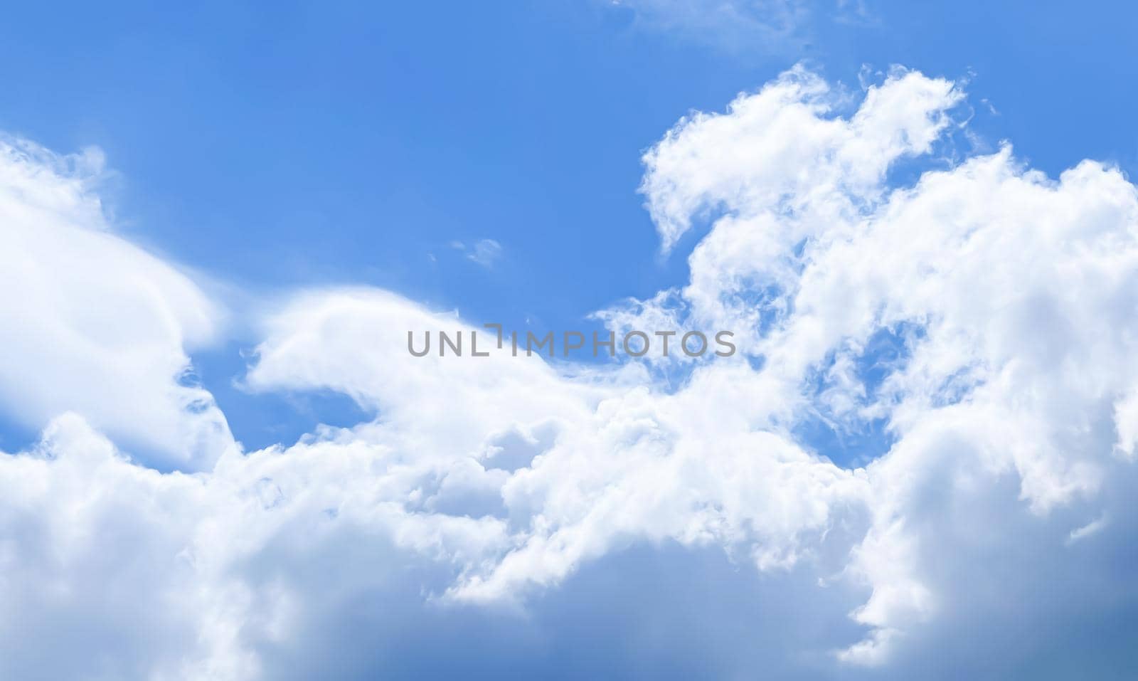 Cloudy sunny sky as abstract background, bright colours, beauty in nature concept