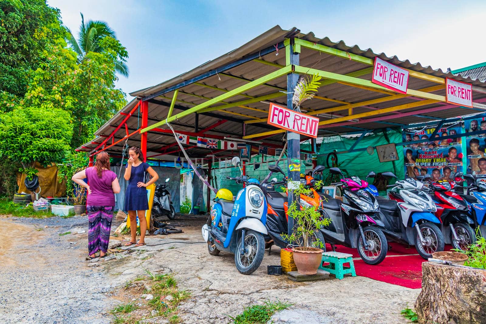 Street road markets shops restaurants cars people Koh Samui Thailand. by Arkadij