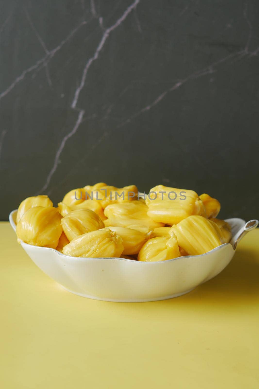 slice of jackfruits in a bowl on table..