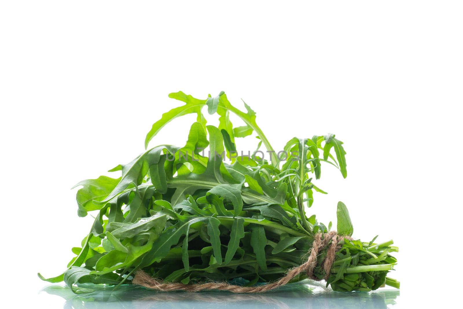 bunch of fresh organic green arugula isolated on white background