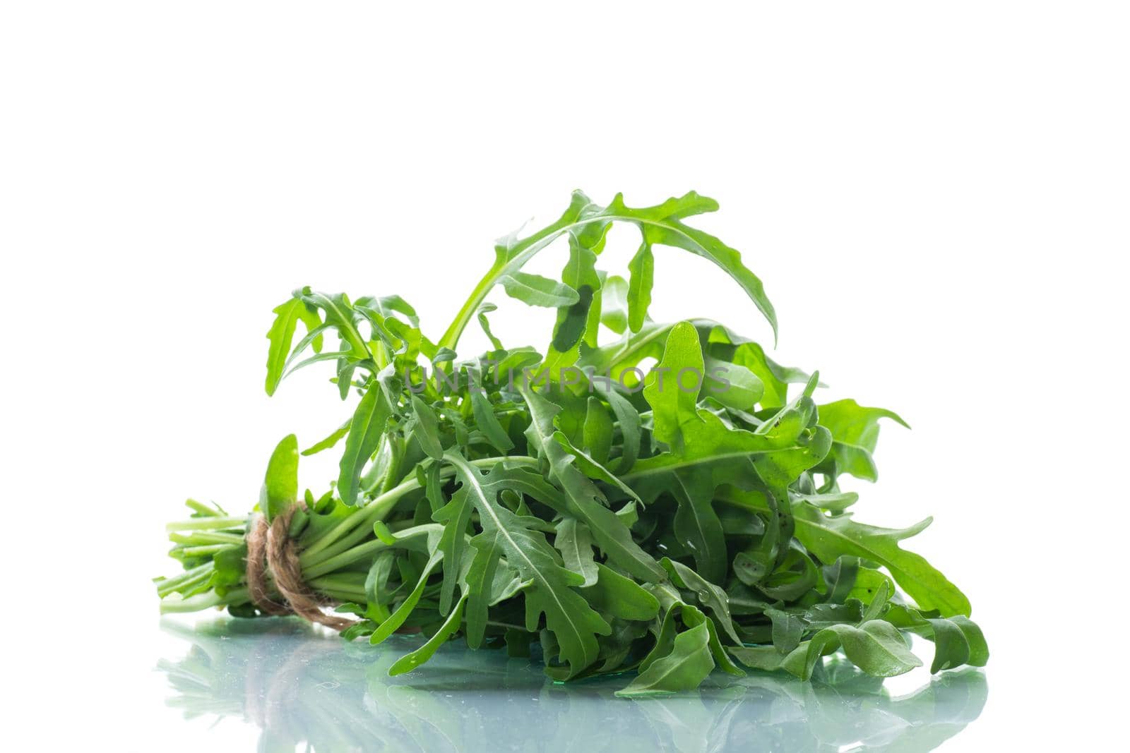 bunch of fresh organic green arugula isolated on white background