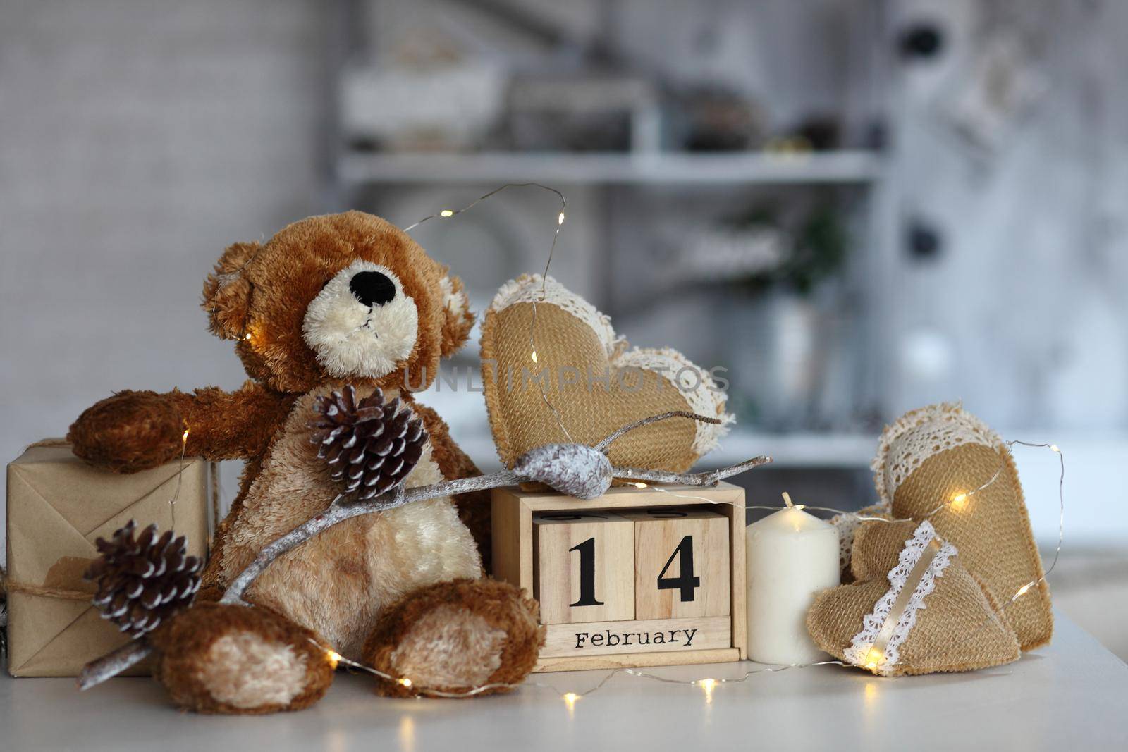 Teddy Bear with heart sitting on wood table, Valentine's day and love concept