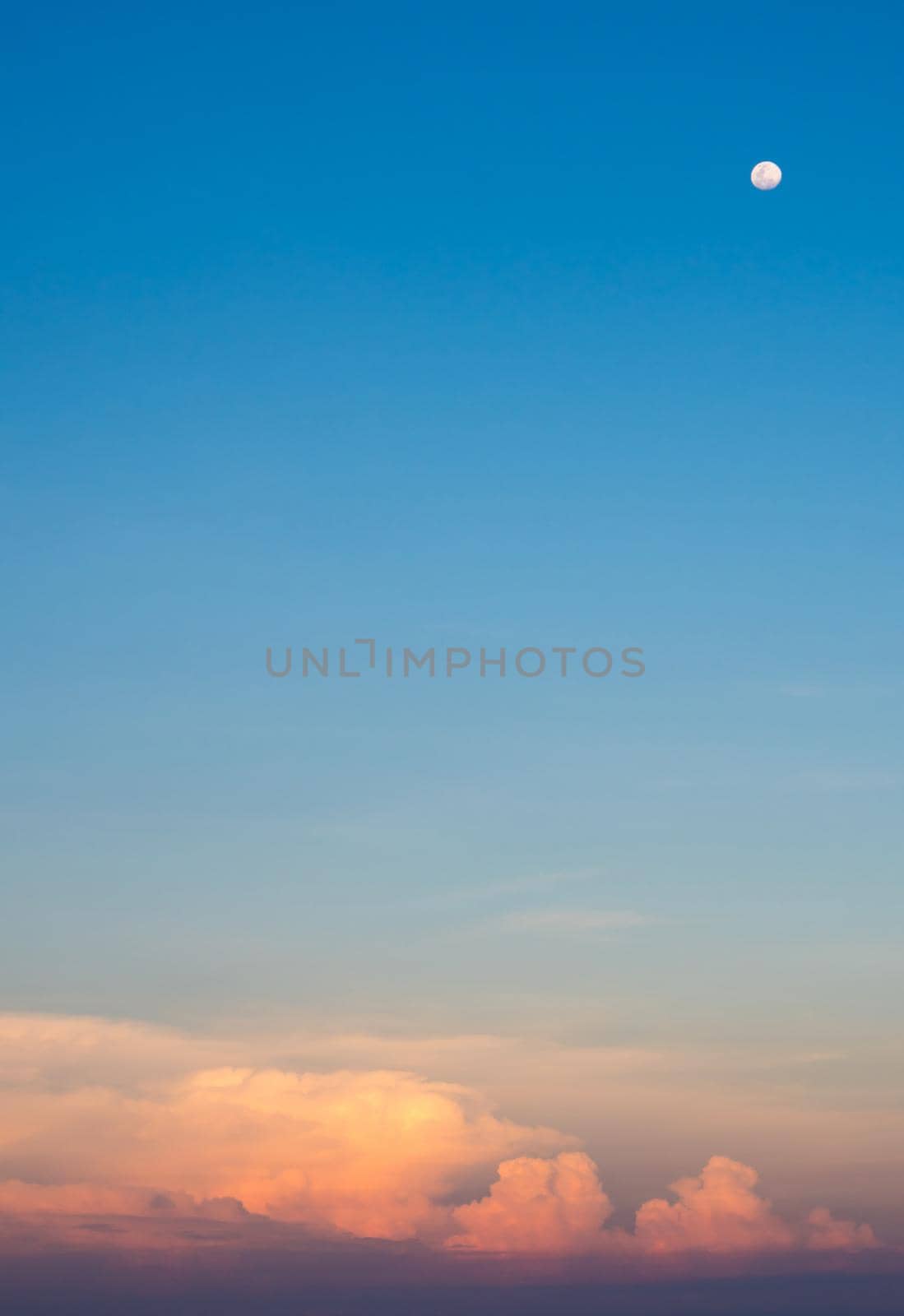 Pink clouds and sunset sky over sea by Satakorn