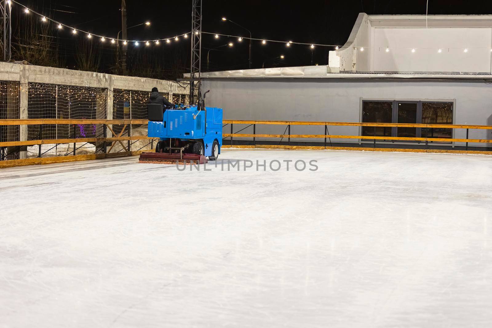 machine leveling the ice on the skating rink