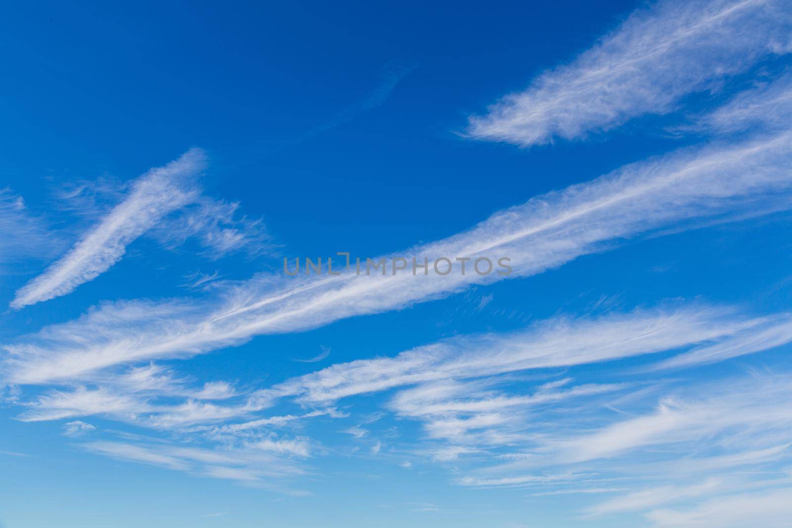 White clouds and stripes in the blue sky