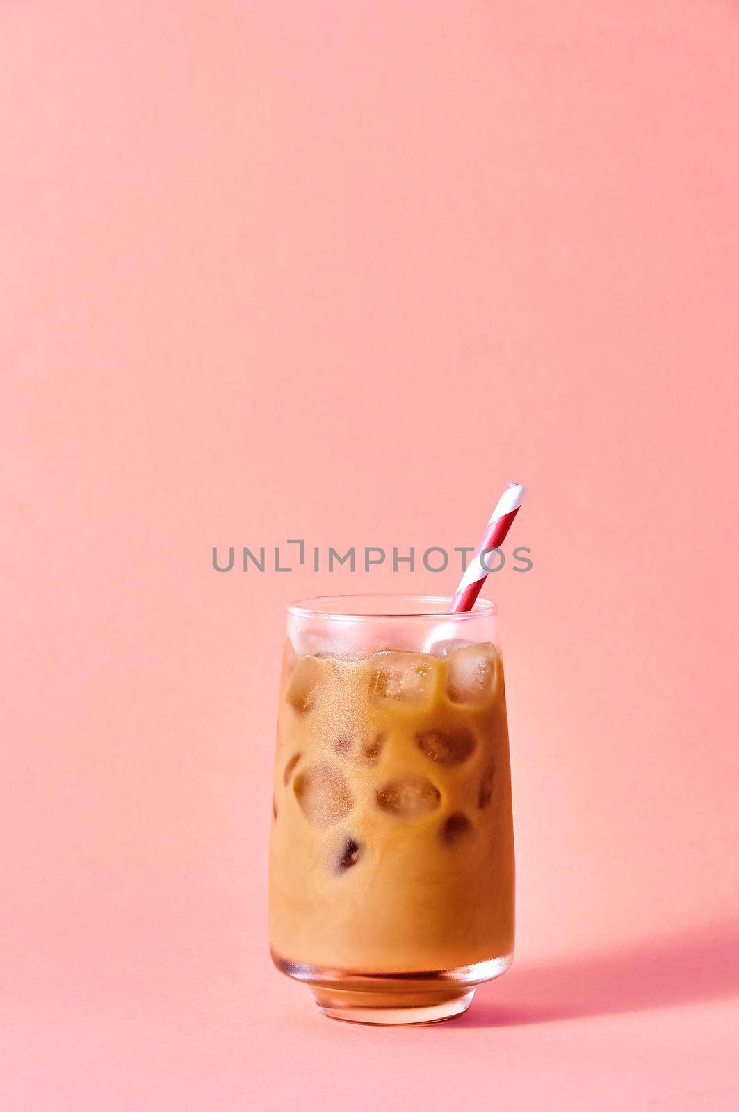 Iced Coffee in Tall Glasses on Pink Background. Concept Refreshing Summer Drink.