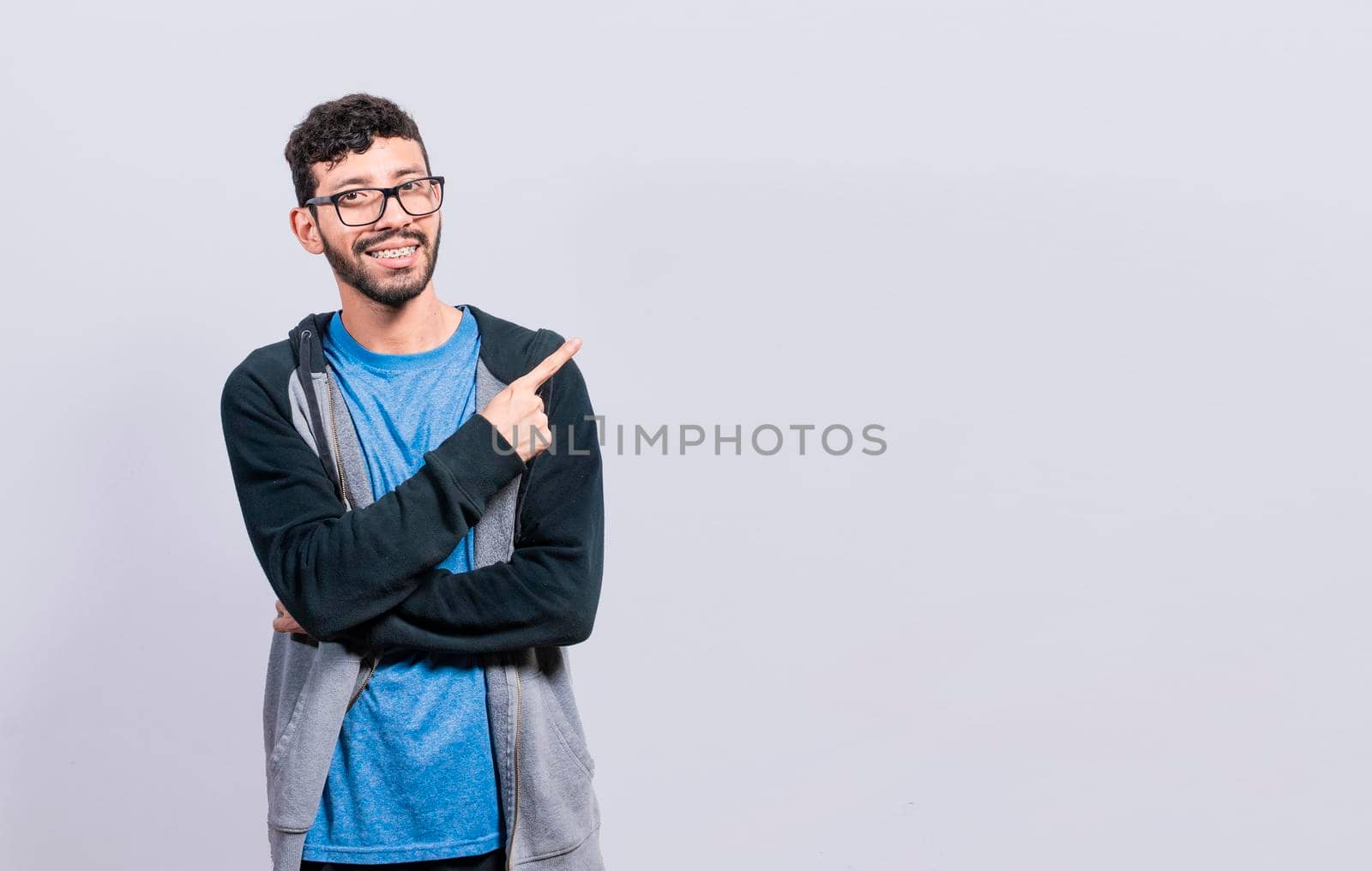 Smiling people pointing a banner to the side, Happy person pointing fingers to the sides, smiling man pointing a space to the side