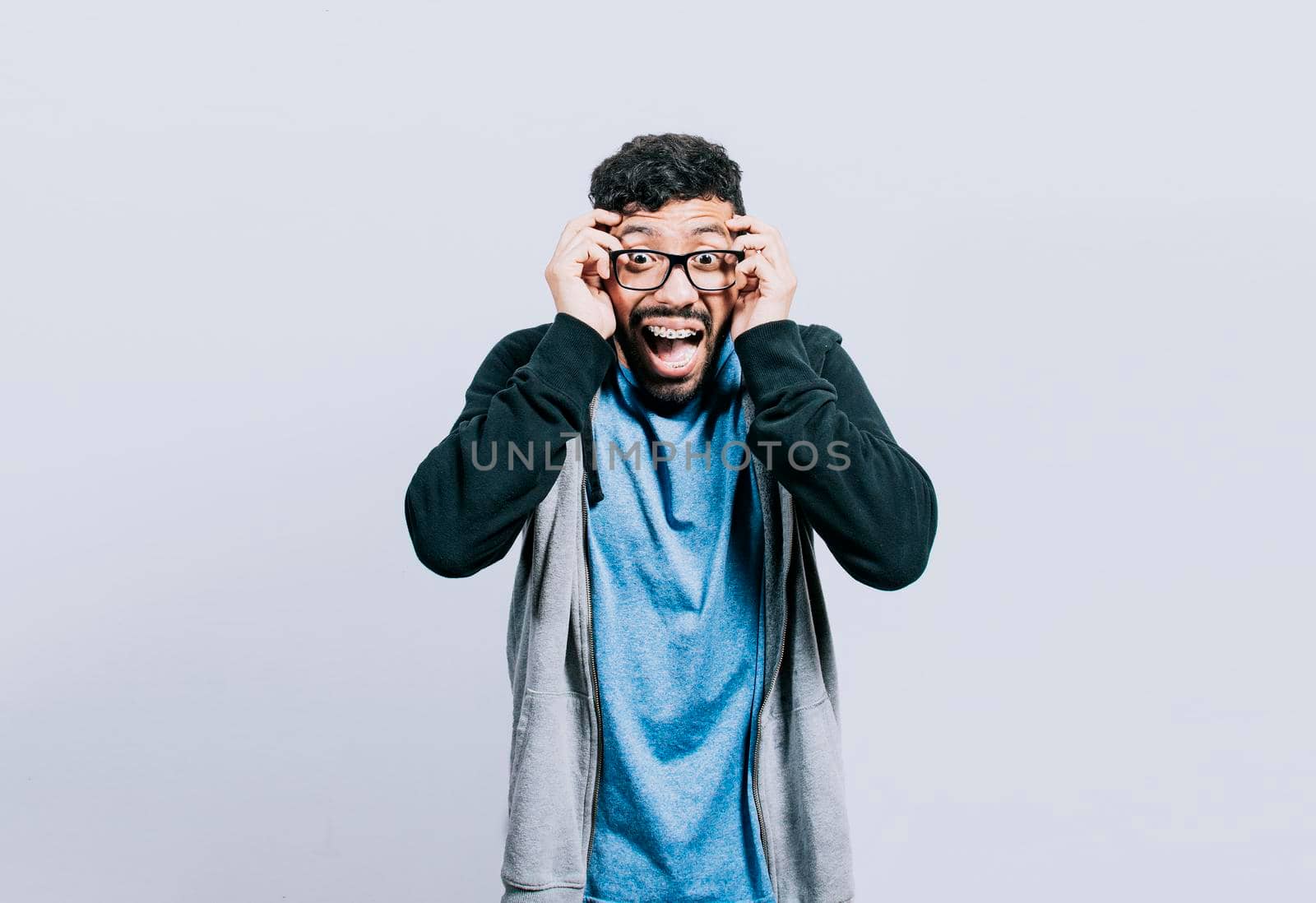 Surprised person opening his mouth, Surprised people with dumbfounded face on isolated background, astonished man holding his head