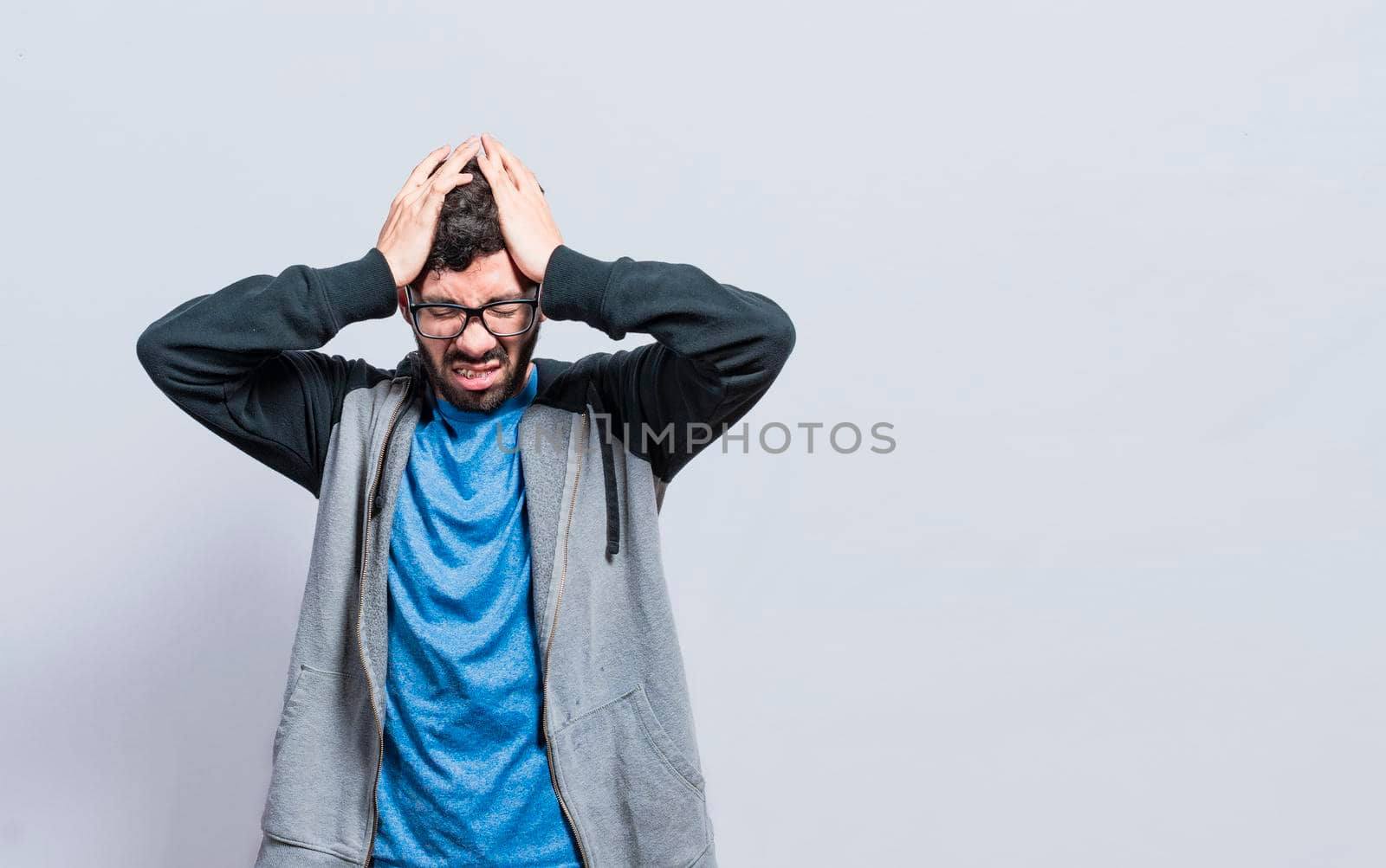 People rubbing his head on isolated background, Concept of a person with a headache, guy giving himself a head massage, concept of a man with a migraine