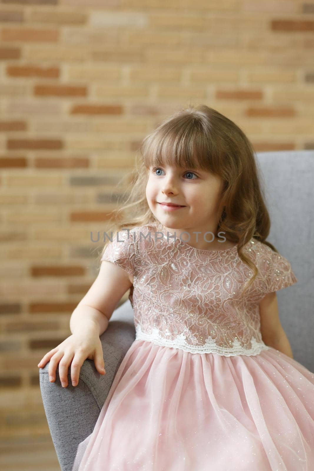Adorable little girl looking at camera at home by BY-_-BY