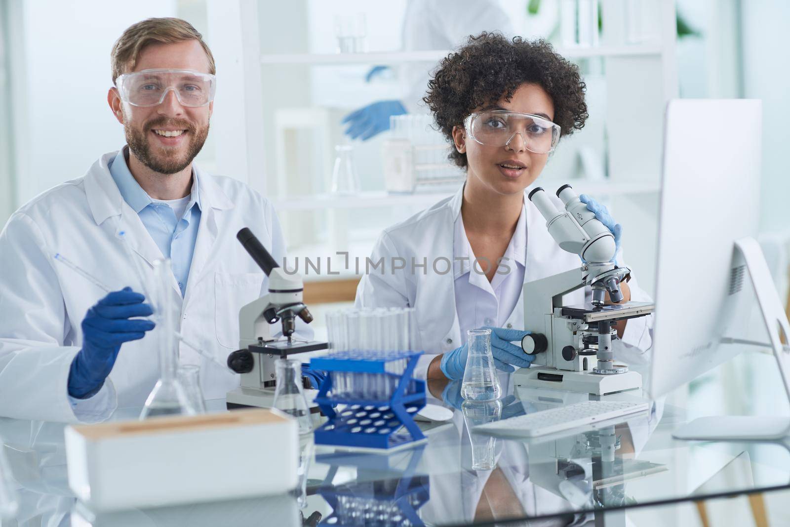 Scientists smiling together in lab