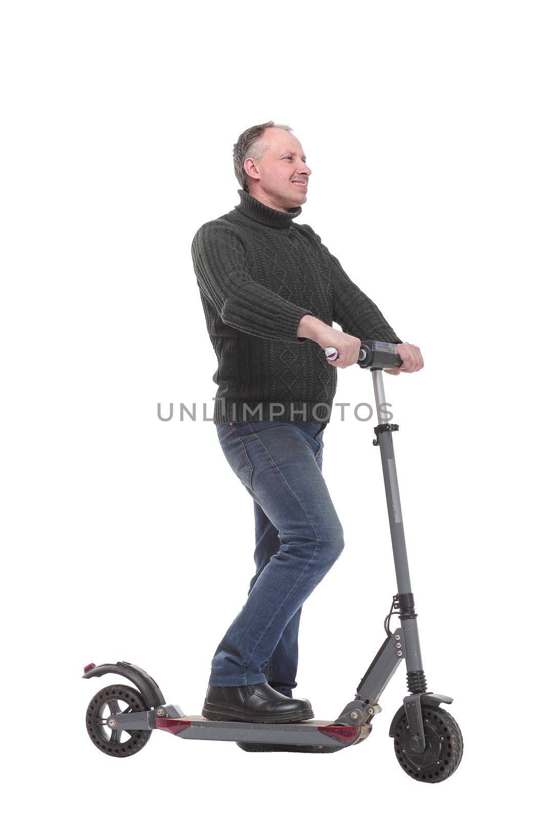 Side view of young modern man using and driving electric isolated over white background. Modern and ecological transportation concept.