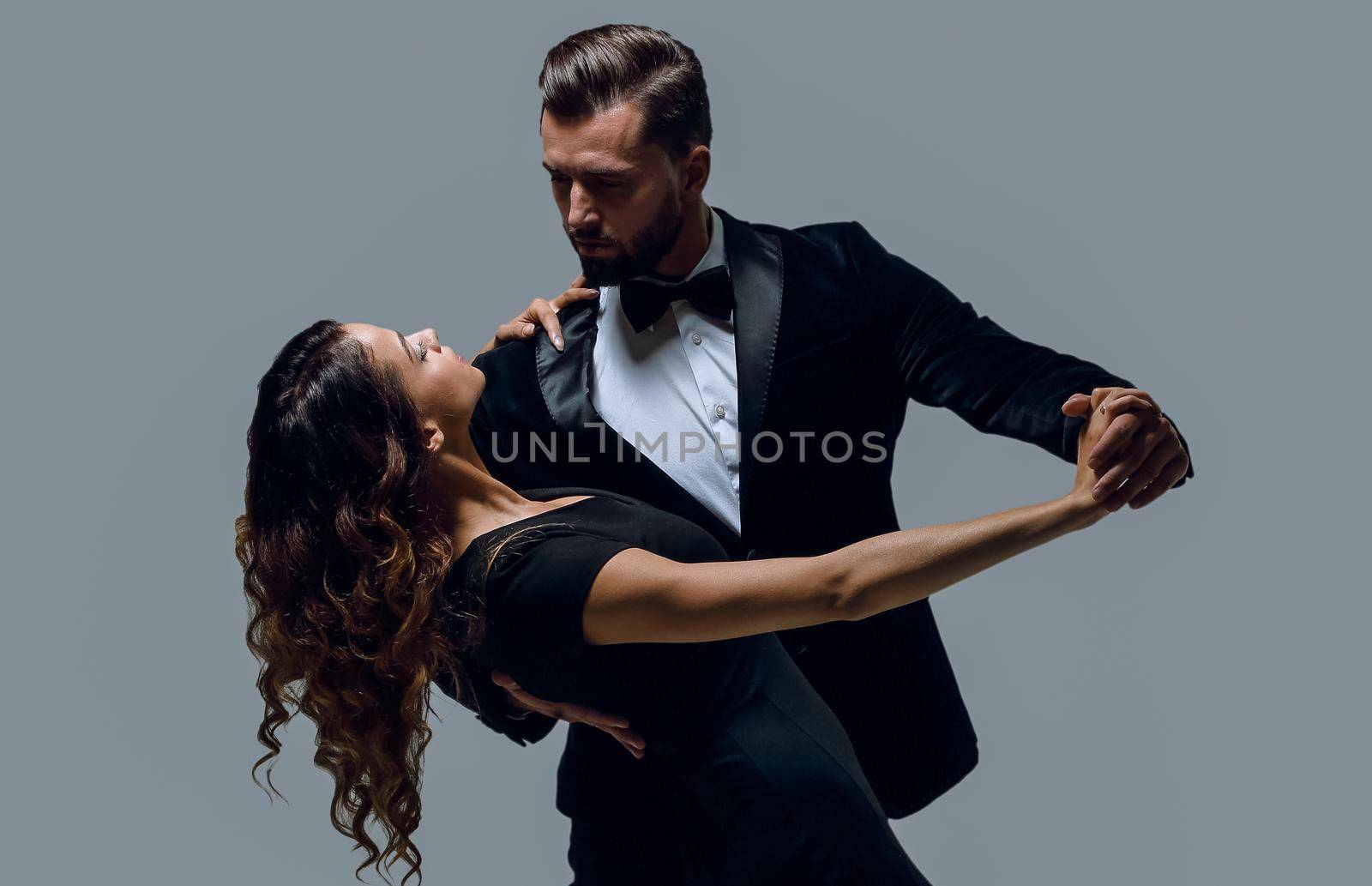 Attractive young couple dancing in studio. by asdf